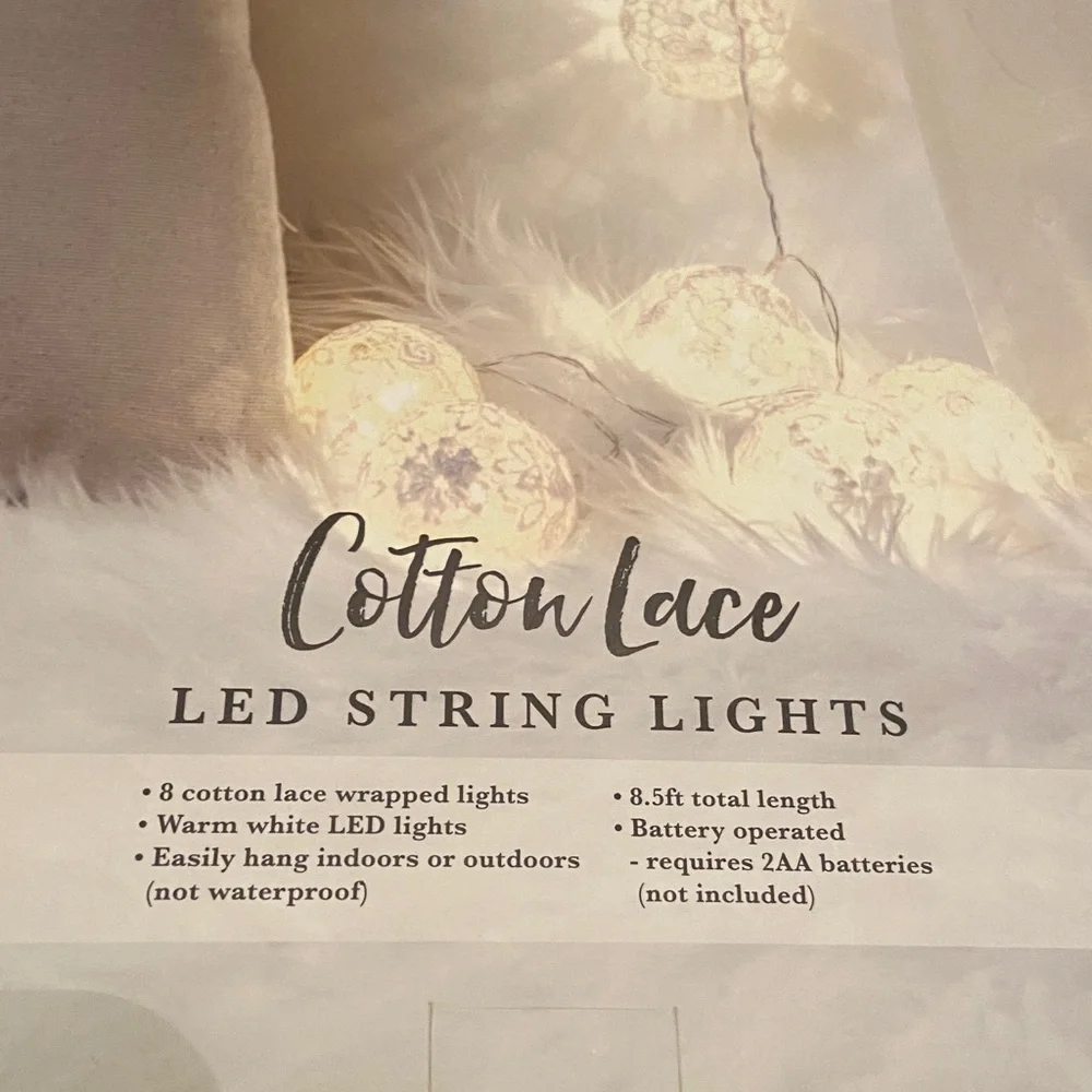 Mercury Innovations Cotton Clear Globe LED String Lights wrapped in white lace.